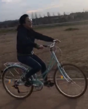 The Bicycle Carrying Lunchboxes 1 Mina on a bike.JPG